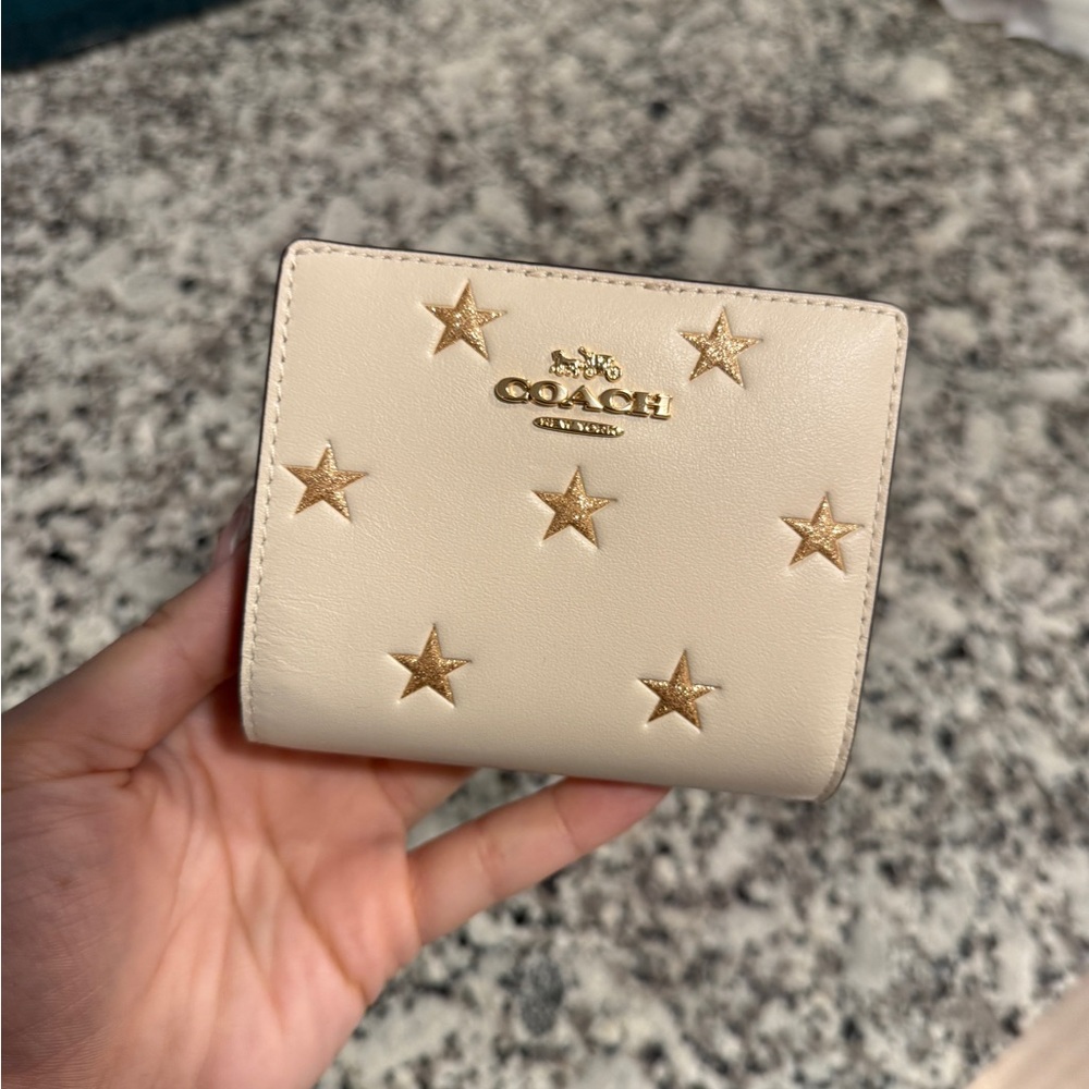 Coach Beige Wallet with Gold Star Embellishments